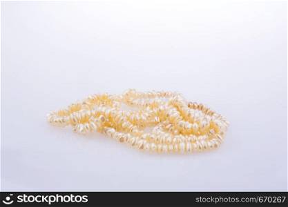 pearl necklace is placed on white background