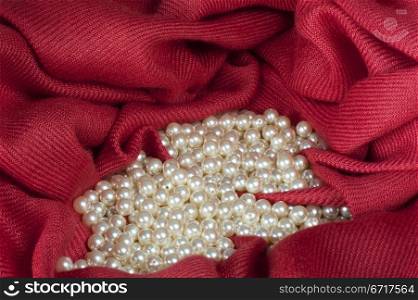 pearls scattered on a colored background fabric