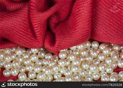 pearls scattered on a colored background fabric