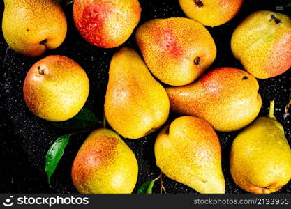 Pears fresh on a black background. High quality photo. Pears fresh on a black background.