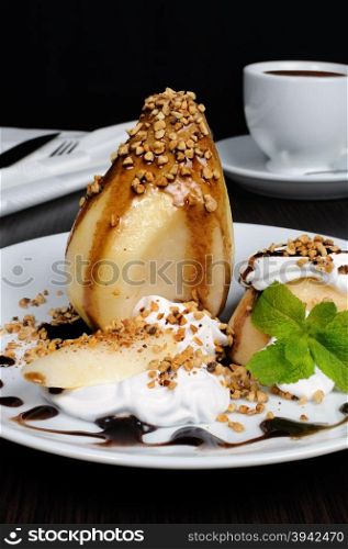 pears with whipped cream sprinkled nuts, almonds and chocolate