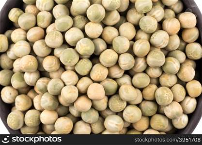 peas in a black plate isolated on white background