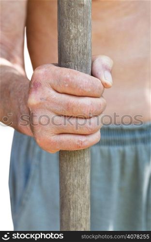 peasant holds old wooden handle of agricultural tool isolated on white background