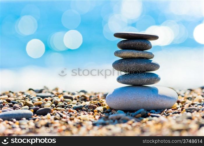 pebble beach and gray spa stones in the form of a tower