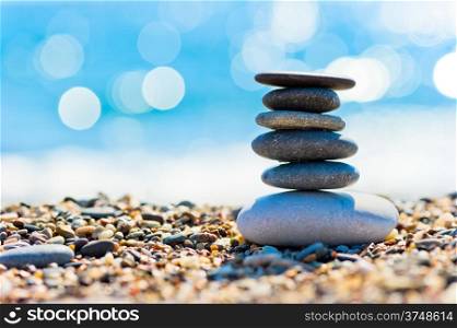 pebble beach and gray spa stones in the form of a tower