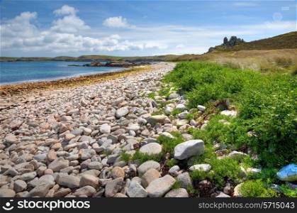 Pebble beach on the Cornish island of St Martin?s, Isles of Scilly, England.