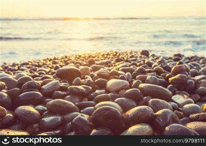 pebble beach on the sea at sunrise