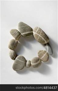 Pebble circle in stone on white background