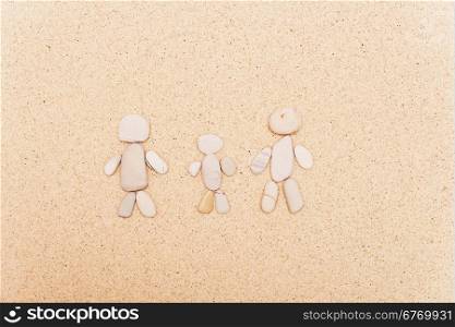 pebble family on a sand