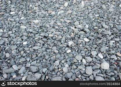 Pebble stone background. Pebble stone background on a beach with daylight