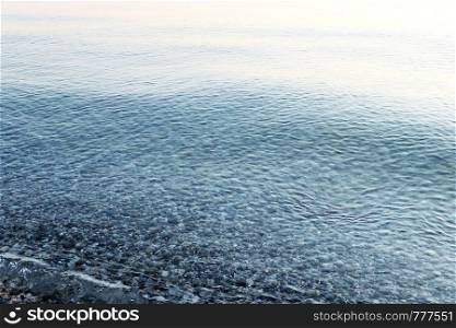 Pebble under water, sea background