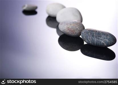Pebbles and shadows on smooth lighting background