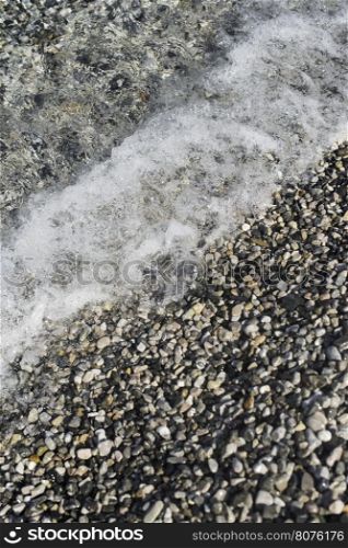 Pebbles beach. Sea waves