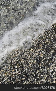 Pebbles beach. Sea waves