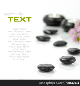 Pebbles, candles and flowers. SPA concept. With sample text