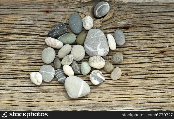 pebbles on wooden background