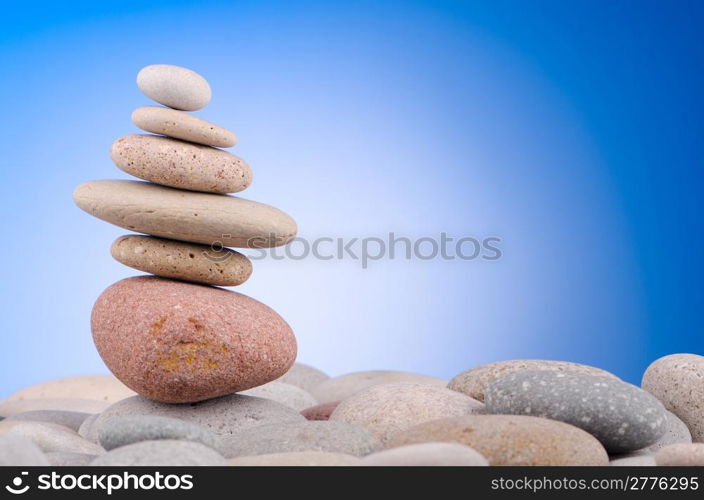 Pebbles stack against gradient background