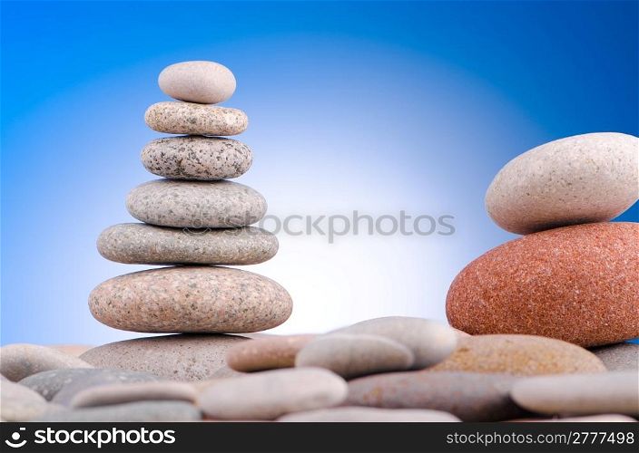 Pebbles stack against gradient background