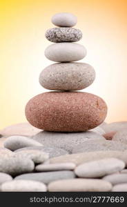 Pebbles stack against gradient background