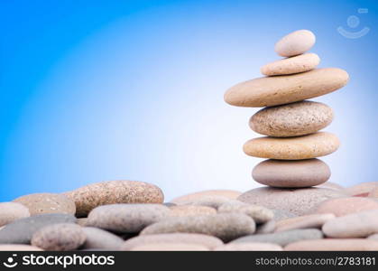 Pebbles stack against gradient background