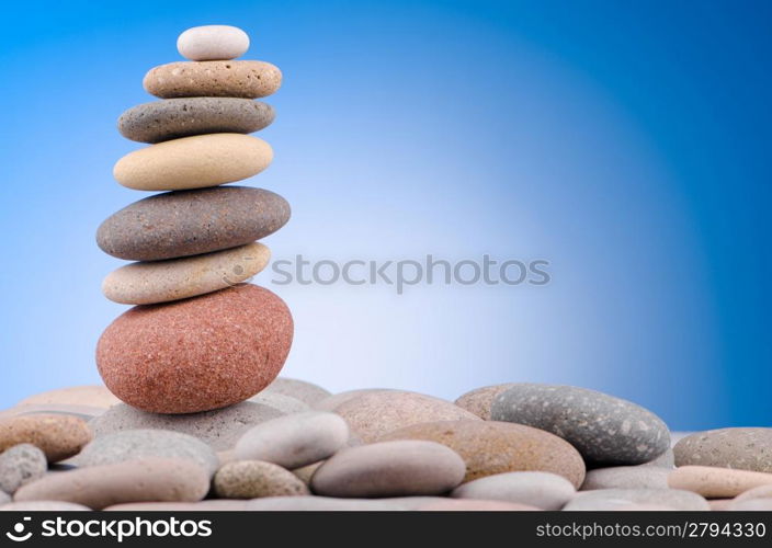 Pebbles stack against gradient background