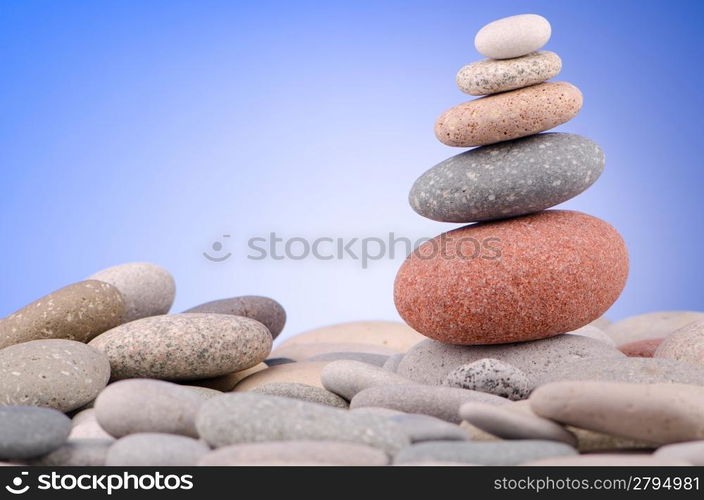 Pebbles stack against gradient background