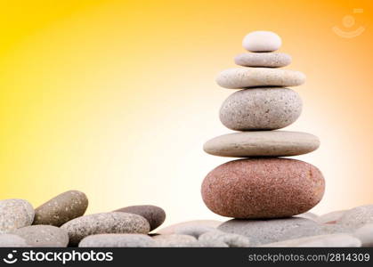 Pebbles stack against gradient background