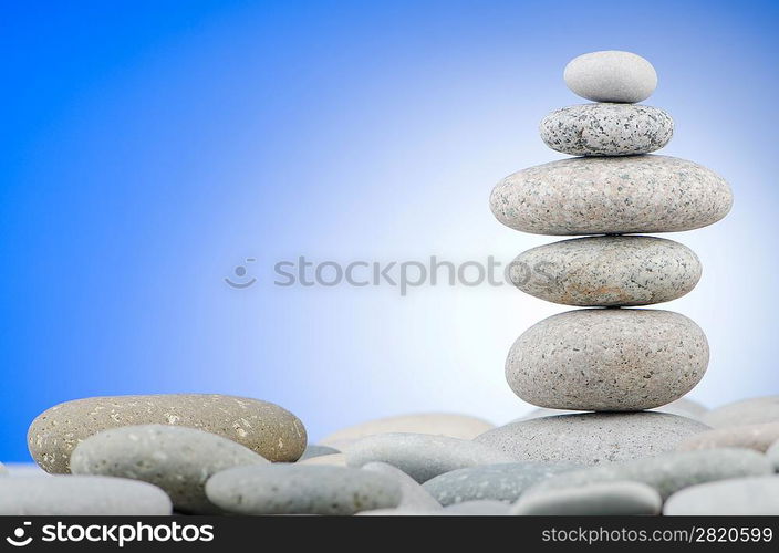 Pebbles stack against gradient background