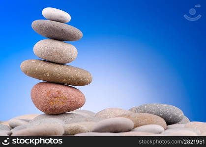 Pebbles stack against gradient background