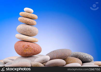 Pebbles stack against gradient background