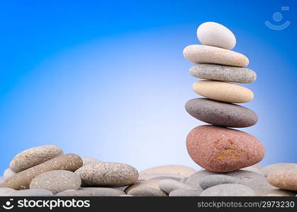 Pebbles stack against gradient background