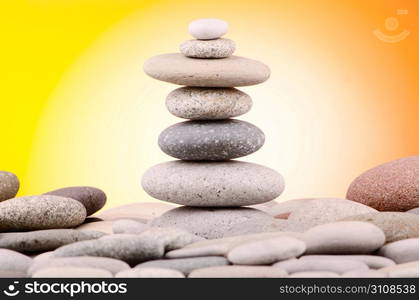 Pebbles stack against gradient background