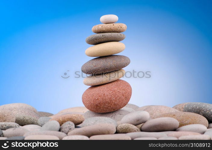 Pebbles stack against gradient background