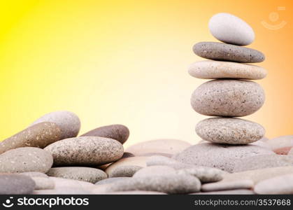 Pebbles stack against gradient background