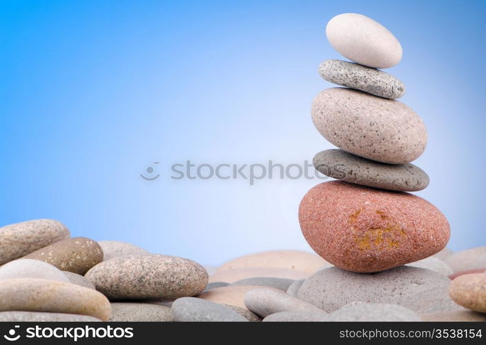 Pebbles stack against gradient background