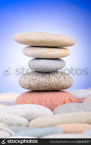 Pebbles stack against gradient background