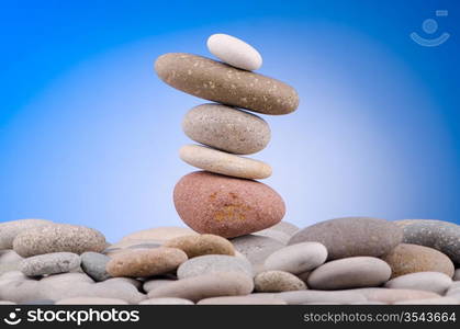 Pebbles stack against gradient background