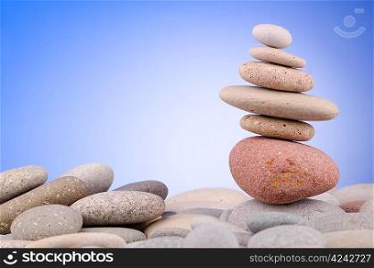 Pebbles stack against gradient background