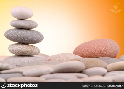 Pebbles stack against gradient background