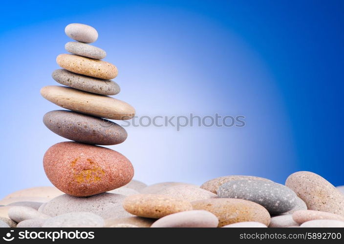 Pebbles stack against gradient background