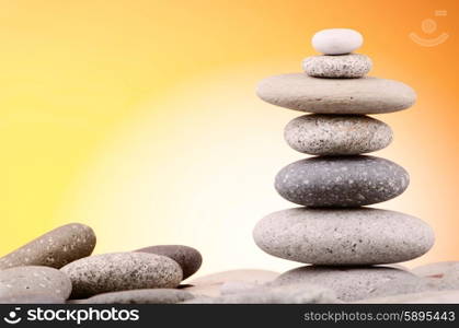 Pebbles stack against gradient background
