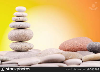 Pebbles stack against gradient background