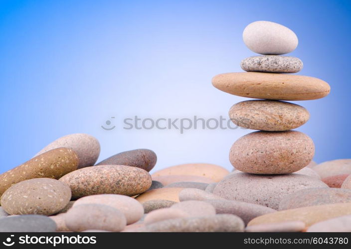 Pebbles stack against gradient background