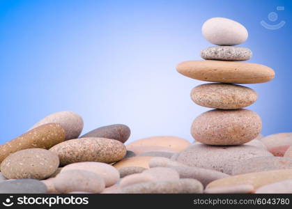 Pebbles stack against gradient background