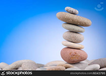 Pebbles stack against gradient background