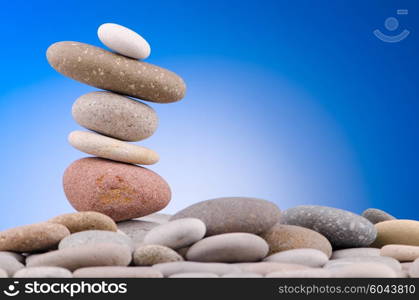 Pebbles stack against gradient background