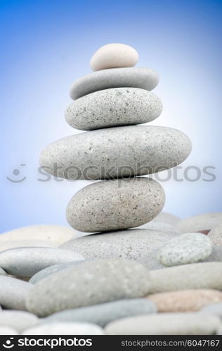 Pebbles stack against gradient background