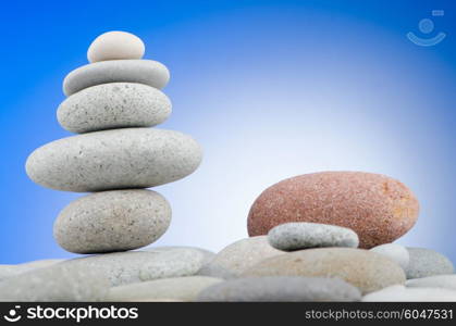 Pebbles stack against gradient background