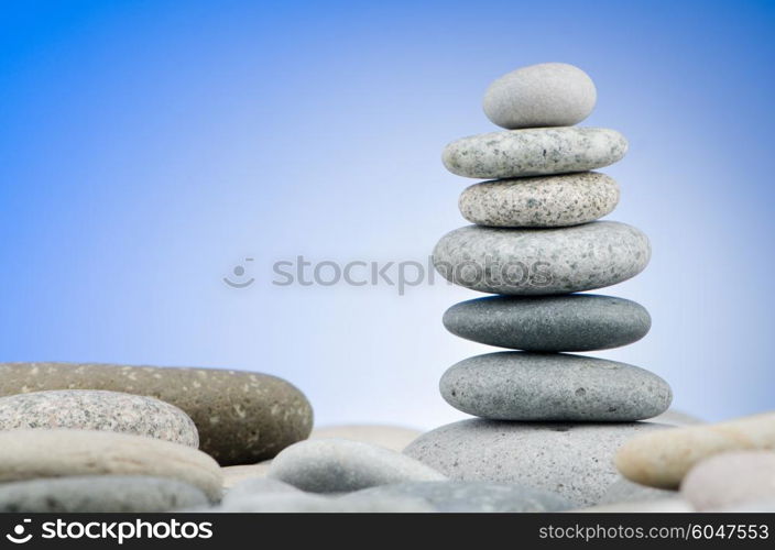 Pebbles stack against gradient background