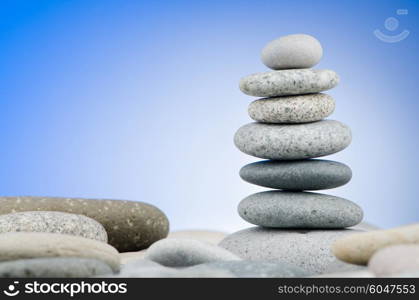 Pebbles stack against gradient background